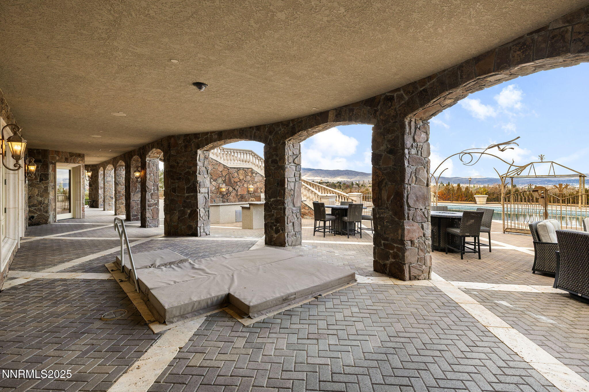 2490 Manzanita Lane Reno, NV 89509 - Photo 123 of 132 a spacious bedroom with a large window and a table