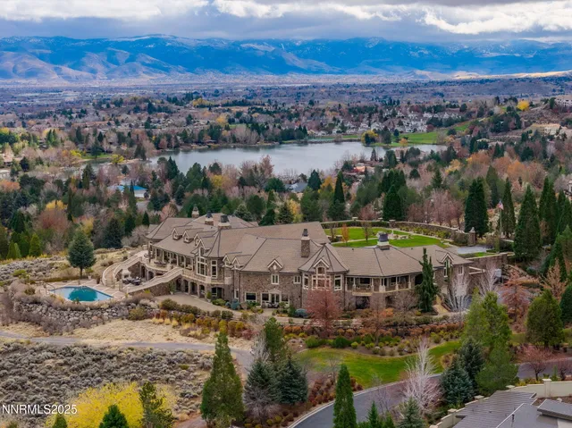 a dining hall with couches and wooden floor