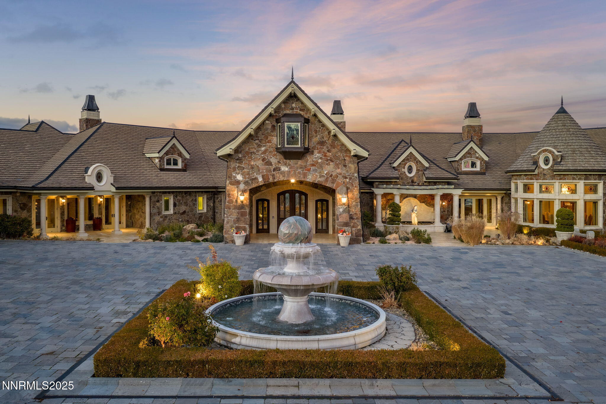 2490 Manzanita Lane Reno, NV 89509 - Photo 5 of 132 a front view of a house with a yard fire pit and outdoor seating