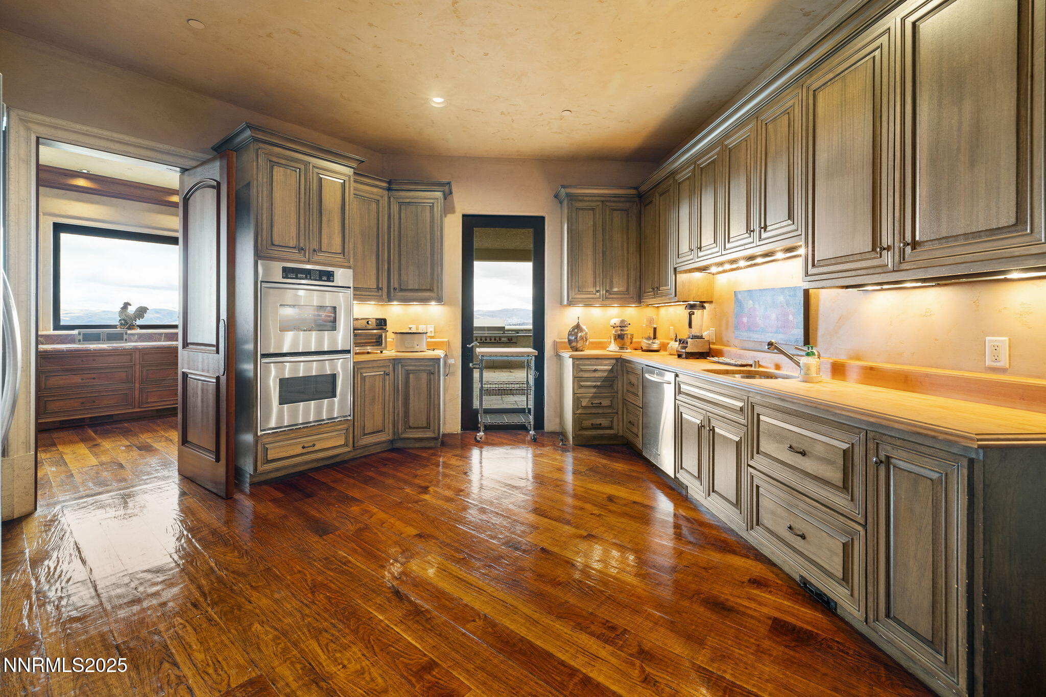 2490 Manzanita Lane Reno, NV 89509 - Photo 55 of 132 a kitchen with stainless steel appliances granite countertop a refrigerator a stove and a sink