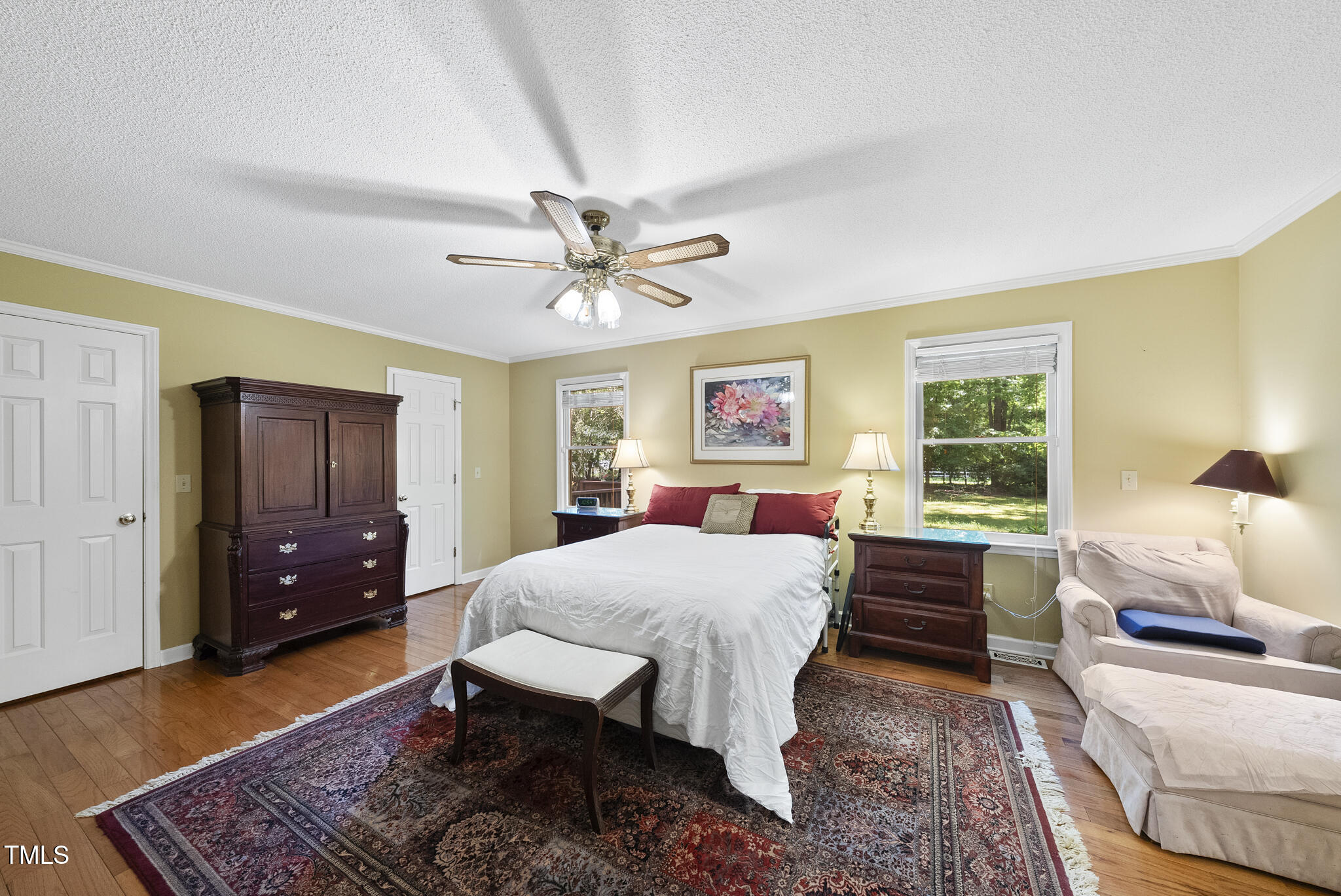 2001 Lovdal Drive Raleigh, NC 27613 - Photo 15 of 42 a bedroom with a bed and wooden floor
