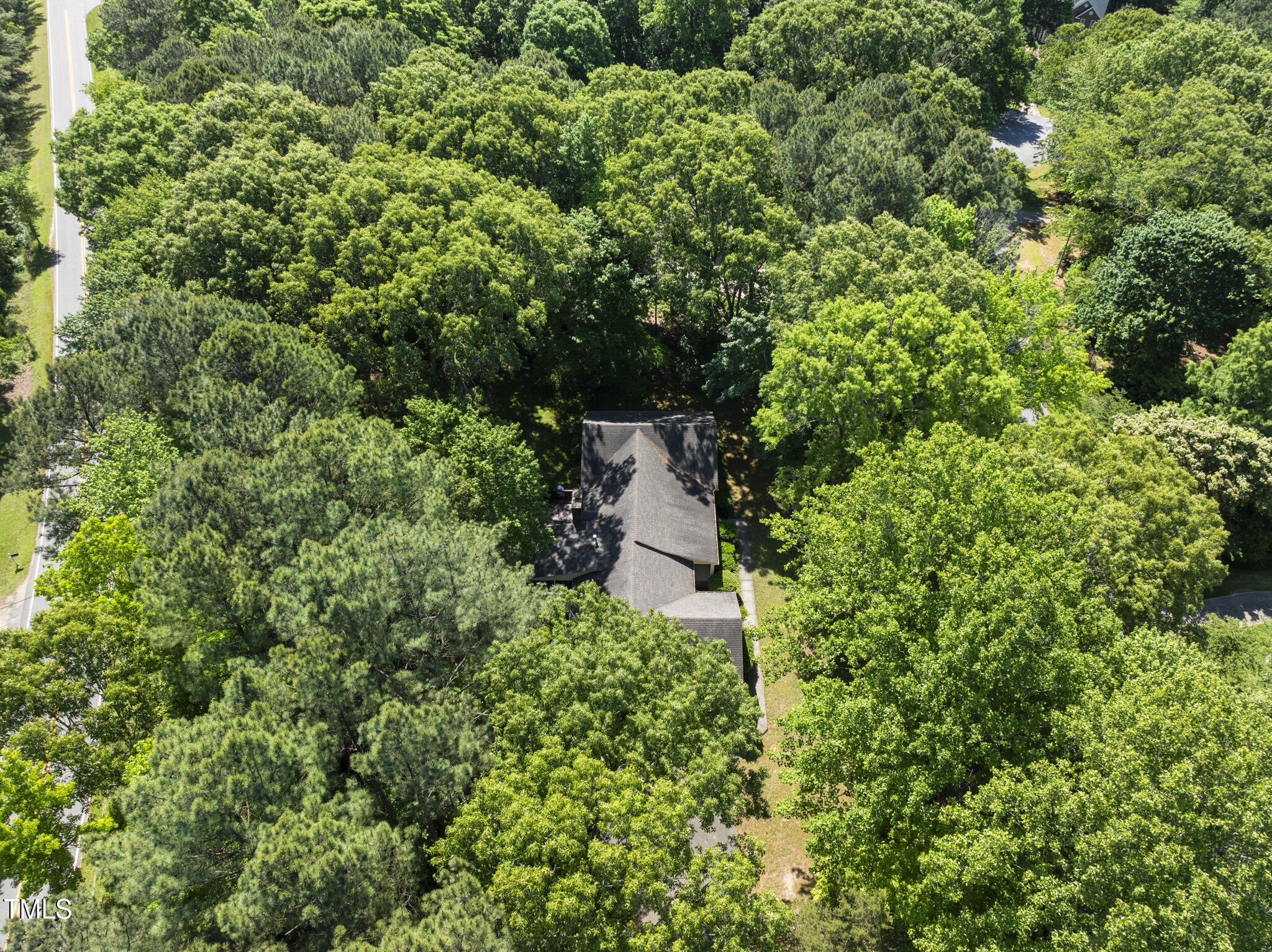 2001 Lovdal Drive Raleigh, NC 27613 - Photo 35 of 42 an aerial view of residential house with outdoor space and trees all around