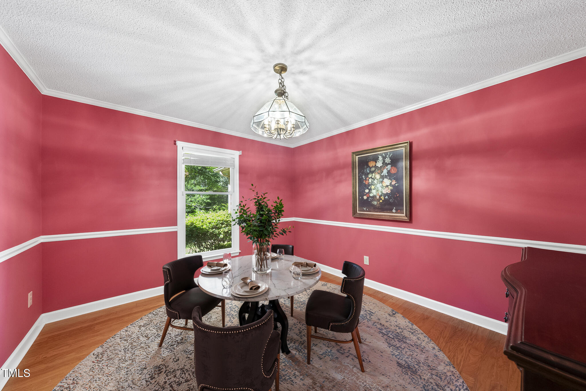 2001 Lovdal Drive Raleigh, NC 27613 - Photo 6 of 42 a view of a dining room with furniture window and wooden floor