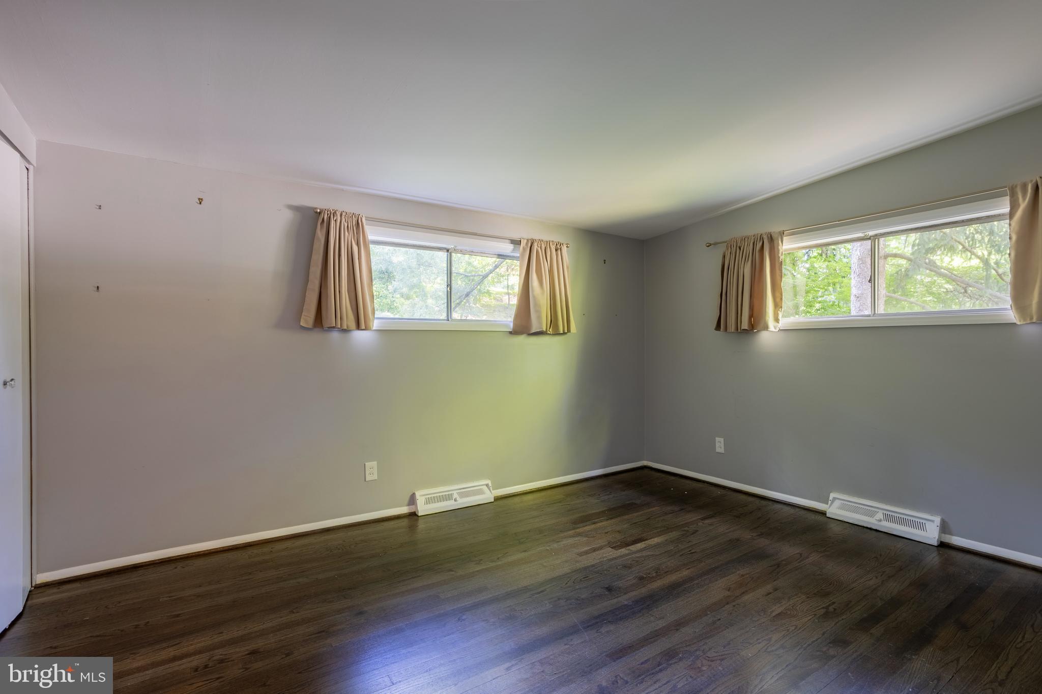 3207 Midfield Road Pikesville, MD 21208 - Photo 27 of 45 a view of a room with wooden floor and windows in it