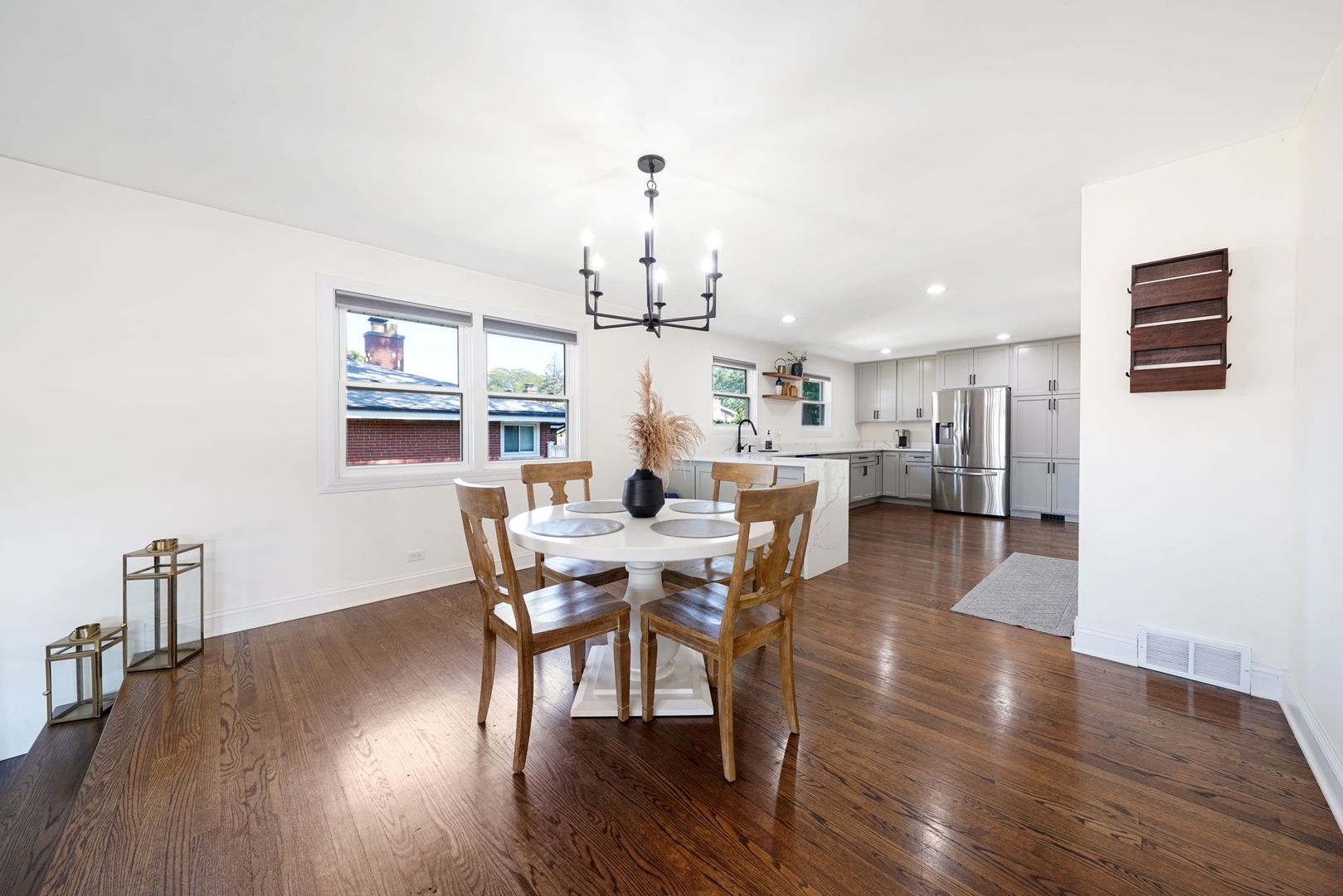 12801 South Ridgeland Avenue Palos Heights, IL 60463 - Photo 13 of 59 a view of a dining room with furniture a chandelier and wooden floor