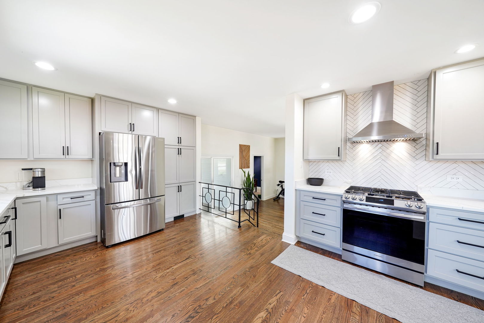12801 South Ridgeland Avenue Palos Heights, IL 60463 - Photo 17 of 59 a kitchen with wooden floors and stainless steel appliances