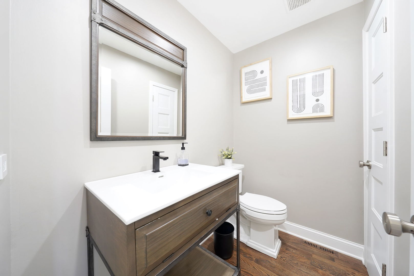 12801 South Ridgeland Avenue Palos Heights, IL 60463 - Photo 26 of 59 a bathroom with a sink mirror and toilet