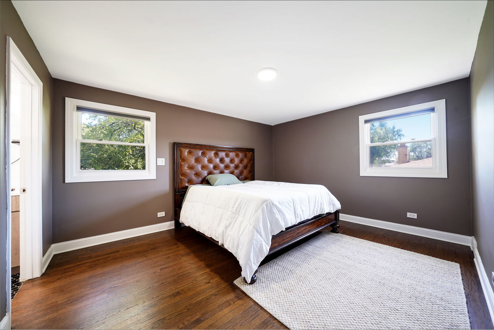 12801 South Ridgeland Avenue Palos Heights, IL 60463 - Photo 27 of 59 a bedroom with a bed and night stand