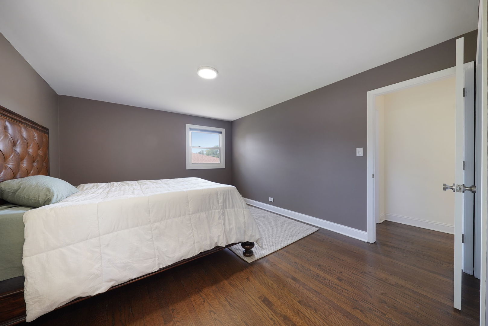 12801 South Ridgeland Avenue Palos Heights, IL 60463 - Photo 28 of 59 a bedroom with a bed and wooden floor