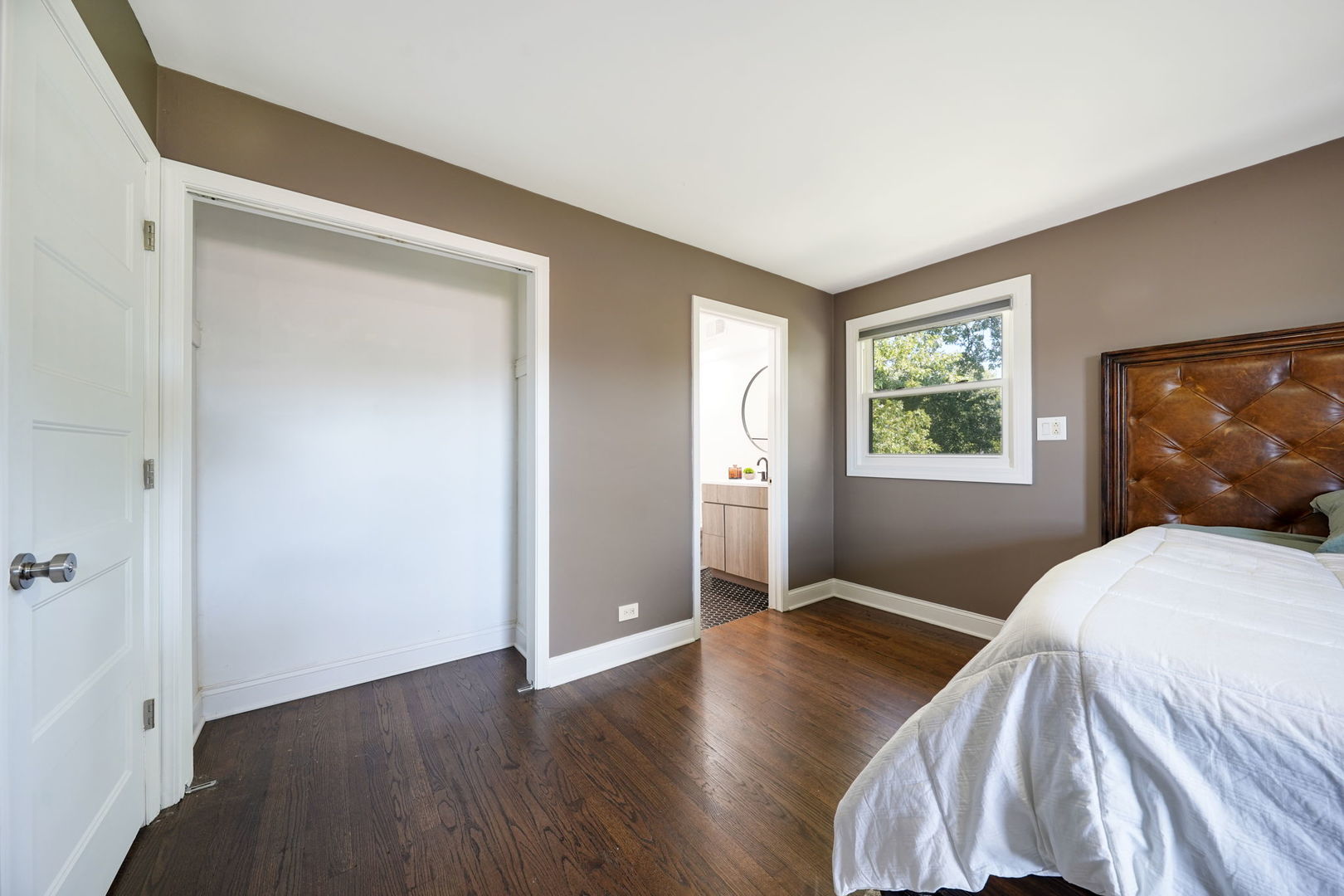 12801 South Ridgeland Avenue Palos Heights, IL 60463 - Photo 29 of 59 a bedroom with a bed and a window