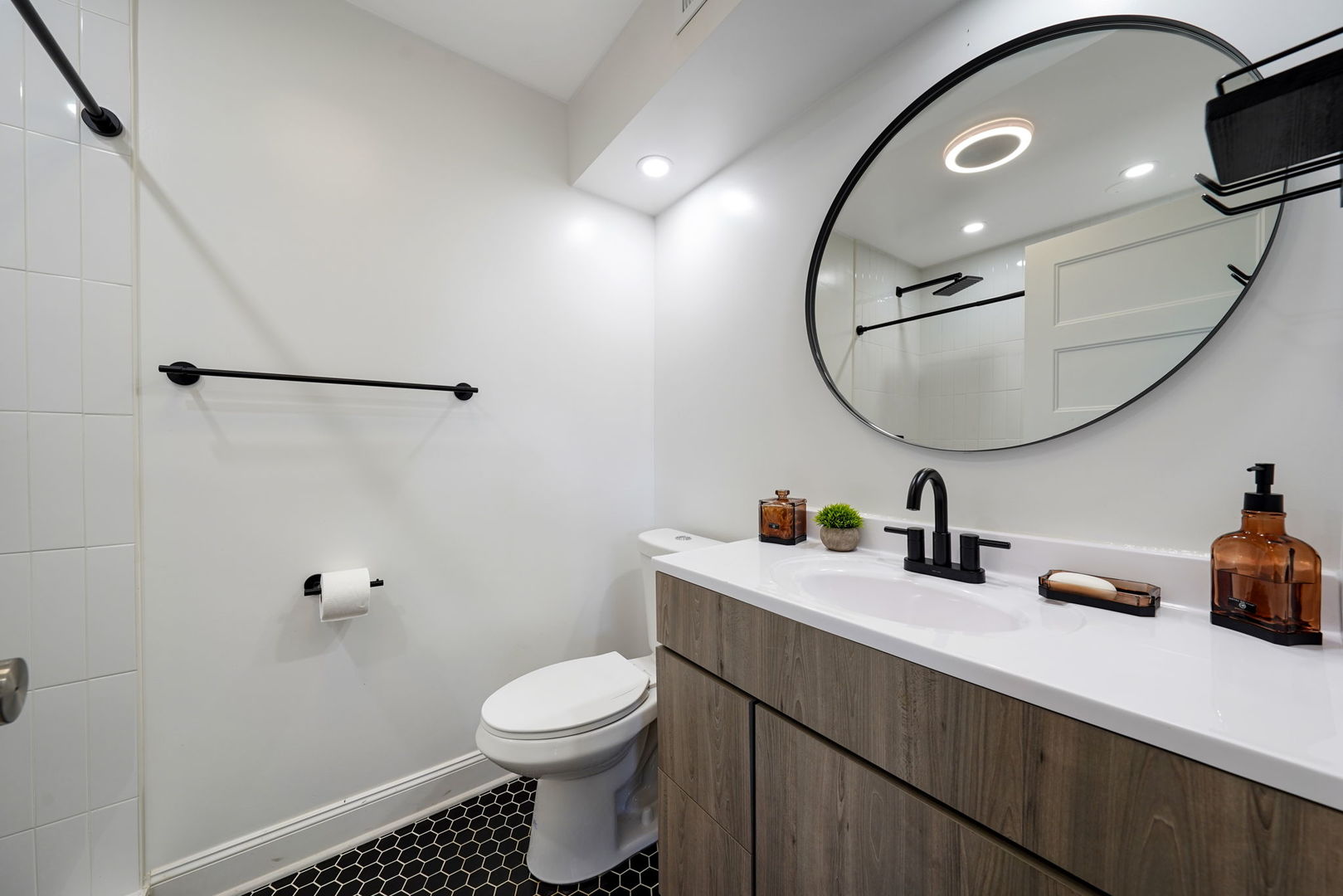 12801 South Ridgeland Avenue Palos Heights, IL 60463 - Photo 30 of 59 a bathroom with a toilet sink and mirror