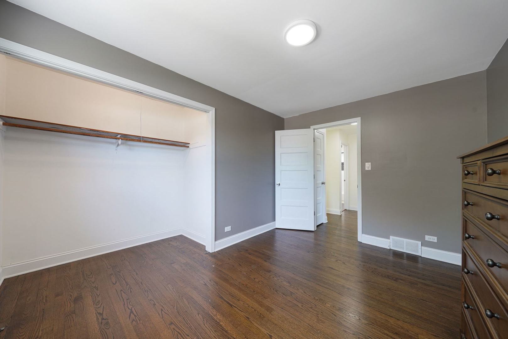 12801 South Ridgeland Avenue Palos Heights, IL 60463 - Photo 36 of 59 a view of an empty room with wooden floor