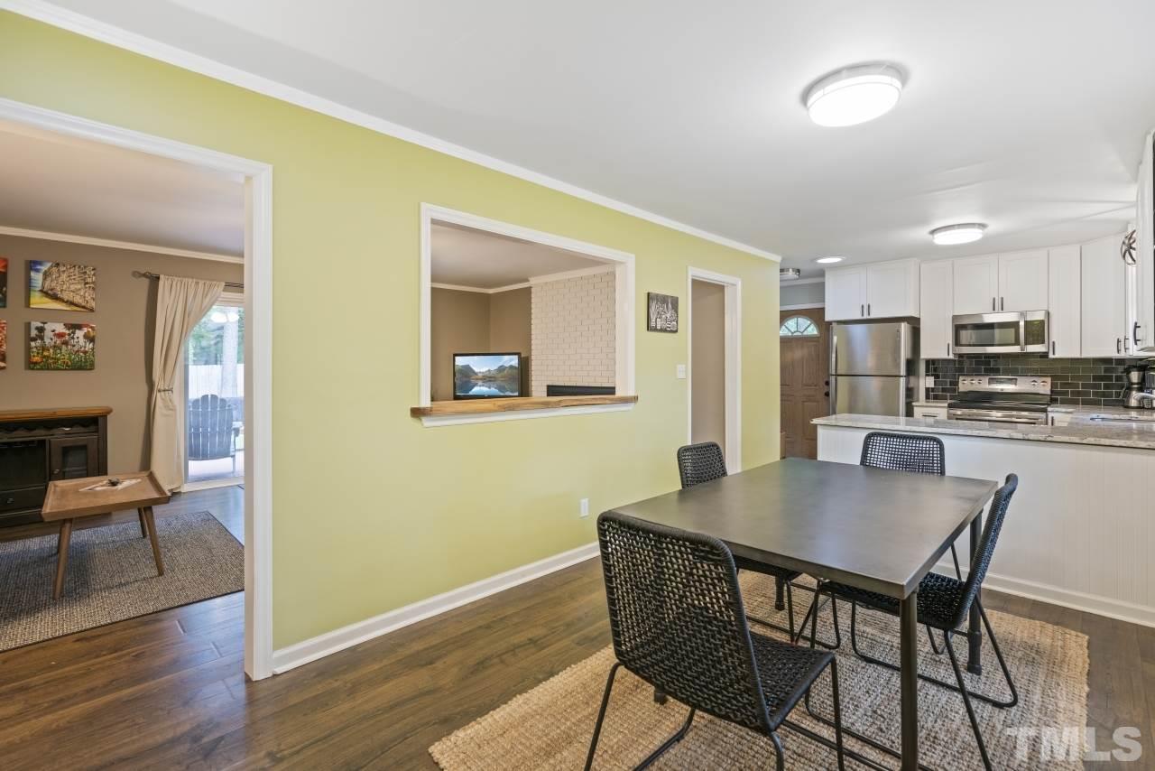 1205 Keith Drive Cary, NC 27511 - Photo 11 of 29 a view of a dining room with furniture and wooden floor