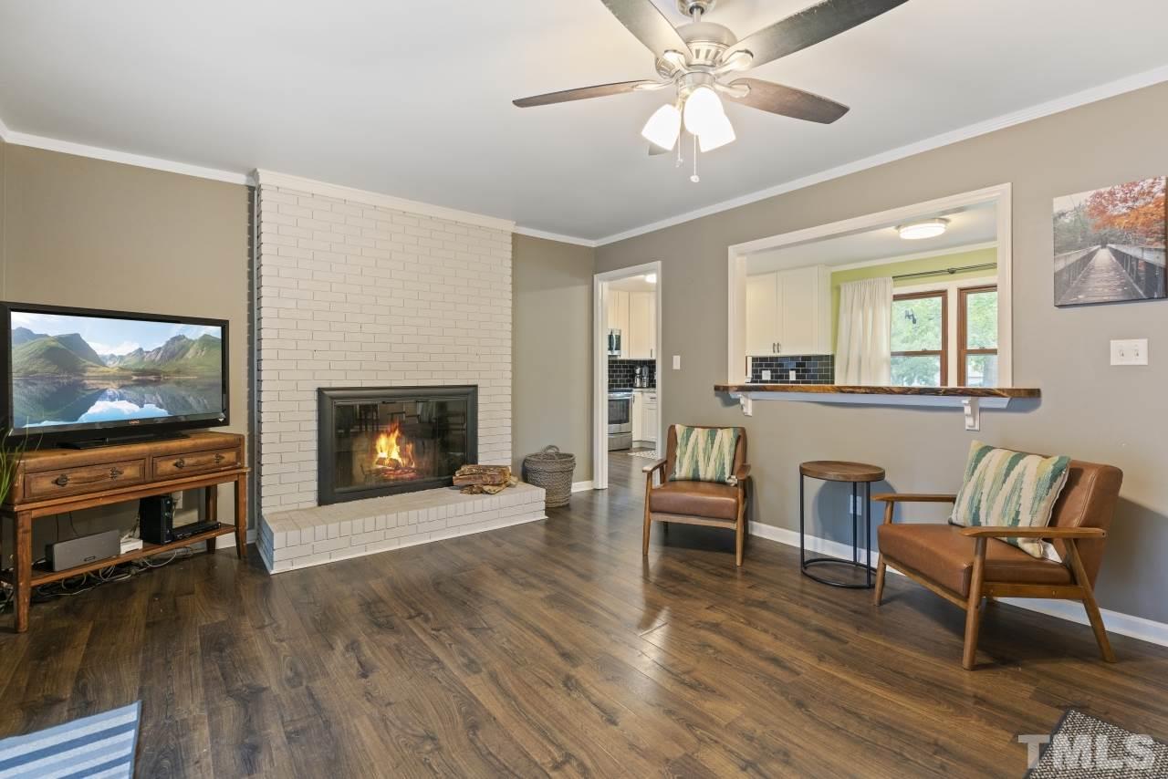 1205 Keith Drive Cary, NC 27511 - Photo 13 of 29 a living room with furniture and a fireplace