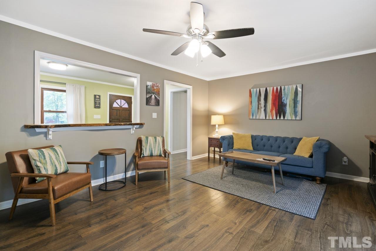 1205 Keith Drive Cary, NC 27511 - Photo 17 of 29 a living room with furniture and a wooden floor