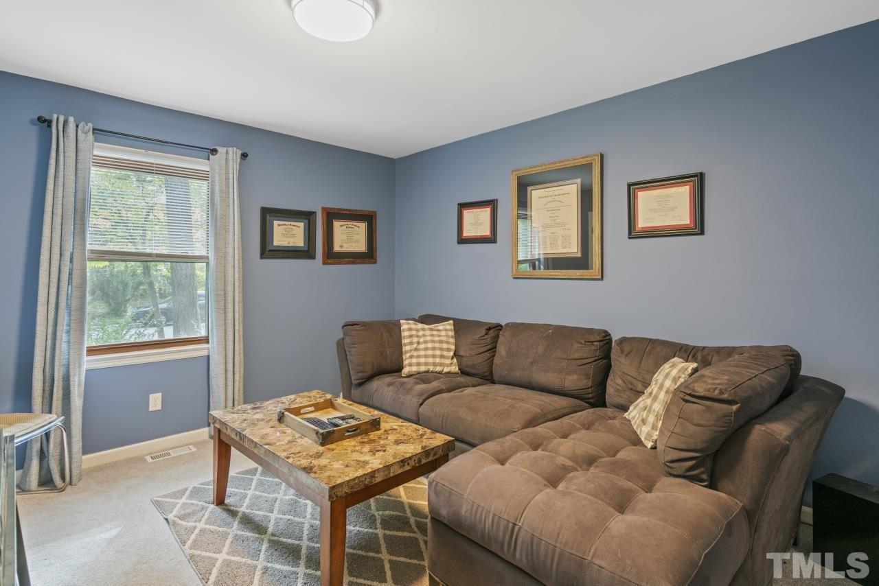 1205 Keith Drive Cary, NC 27511 - Photo 20 of 29 a living room with furniture and a window