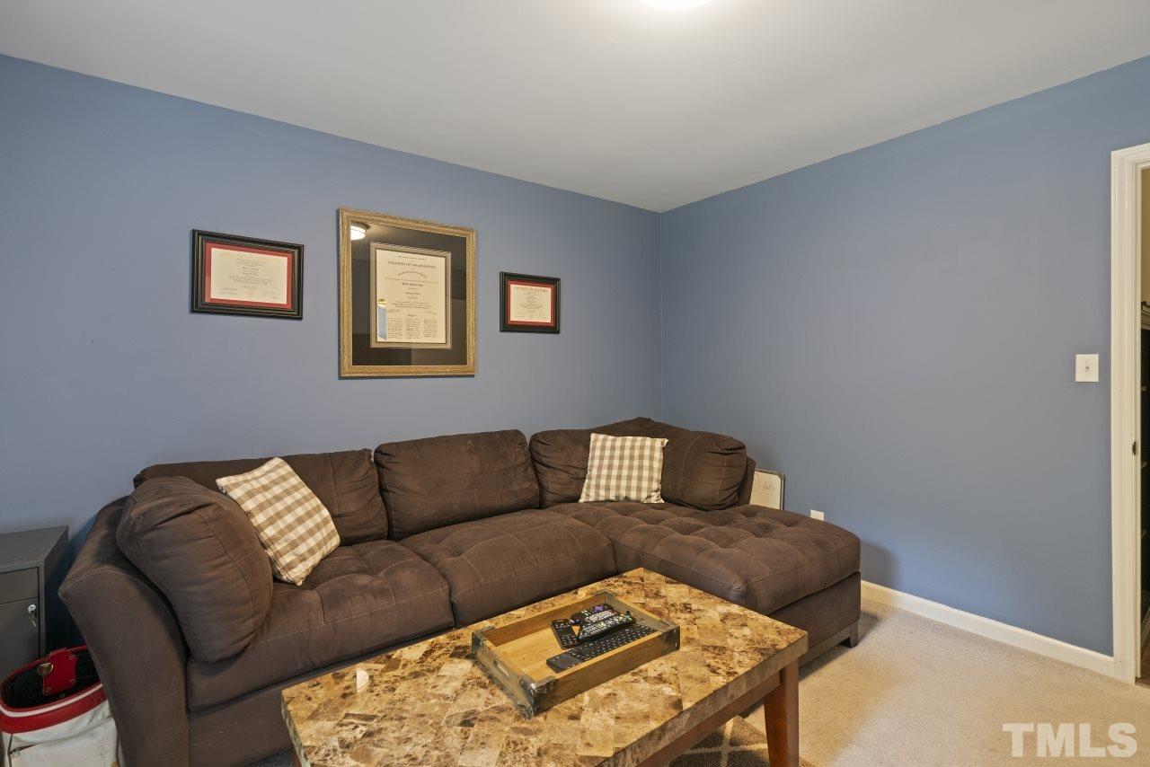 1205 Keith Drive Cary, NC 27511 - Photo 21 of 29 a living room with furniture and a couch