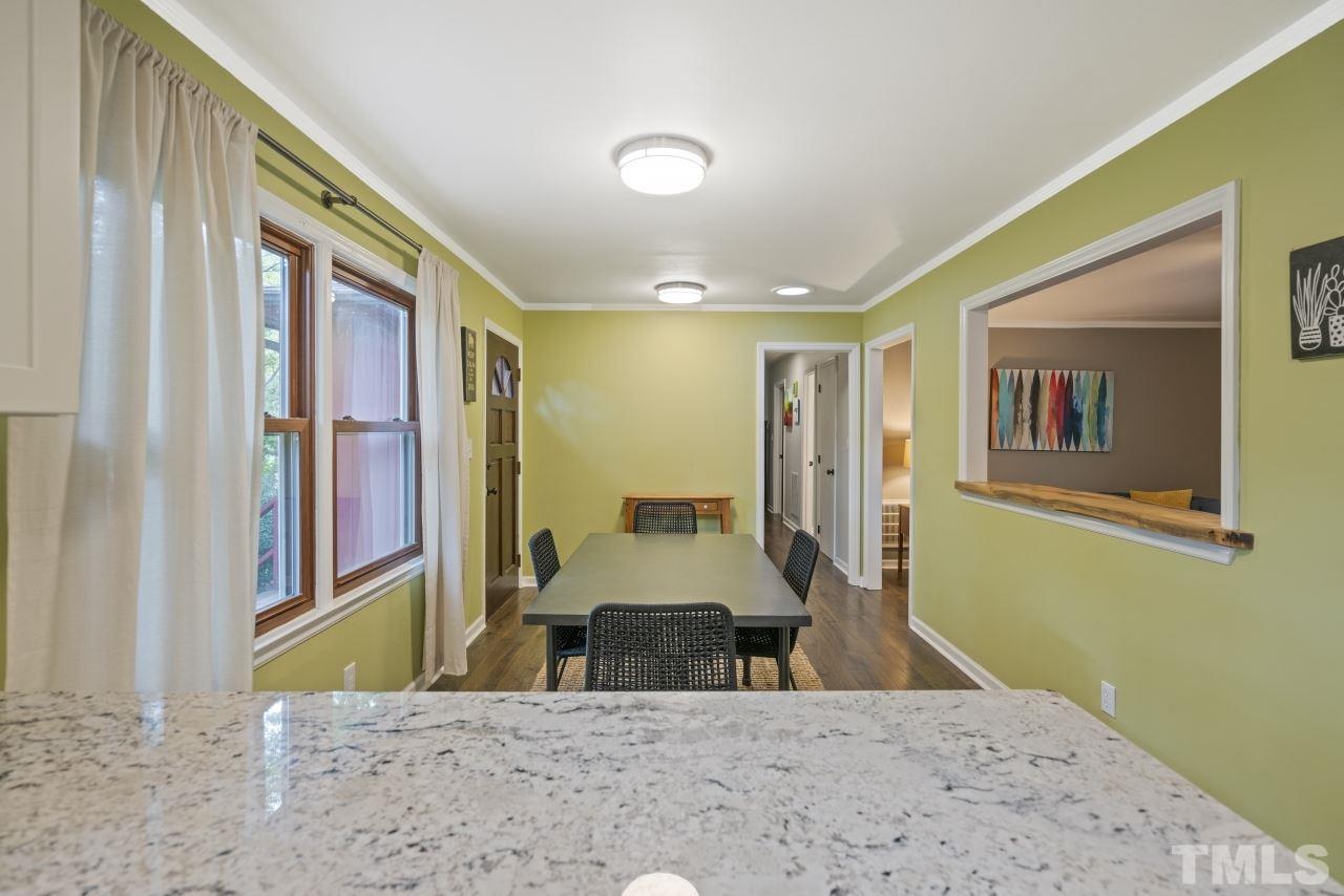 1205 Keith Drive Cary, NC 27511 - Photo 10 of 29 a spacious bedroom with a large bed and a window