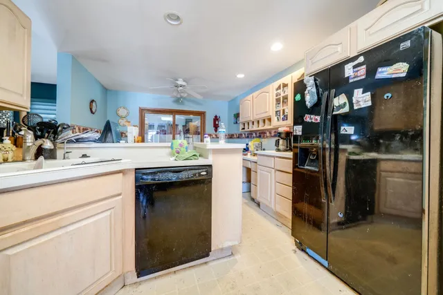 a kitchen with sink cabinets and window
