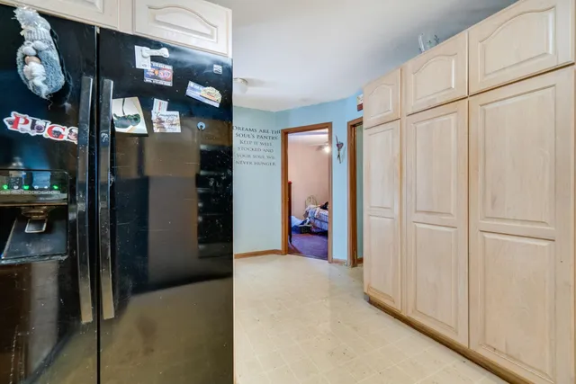 a open kitchen with stainless steel appliances granite countertop a stove and cabinets
