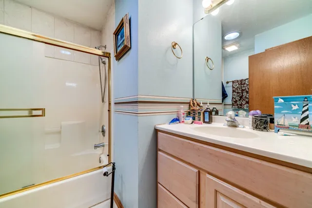 a room with furniture pool table and window