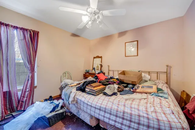a room with furniture pool table and windows