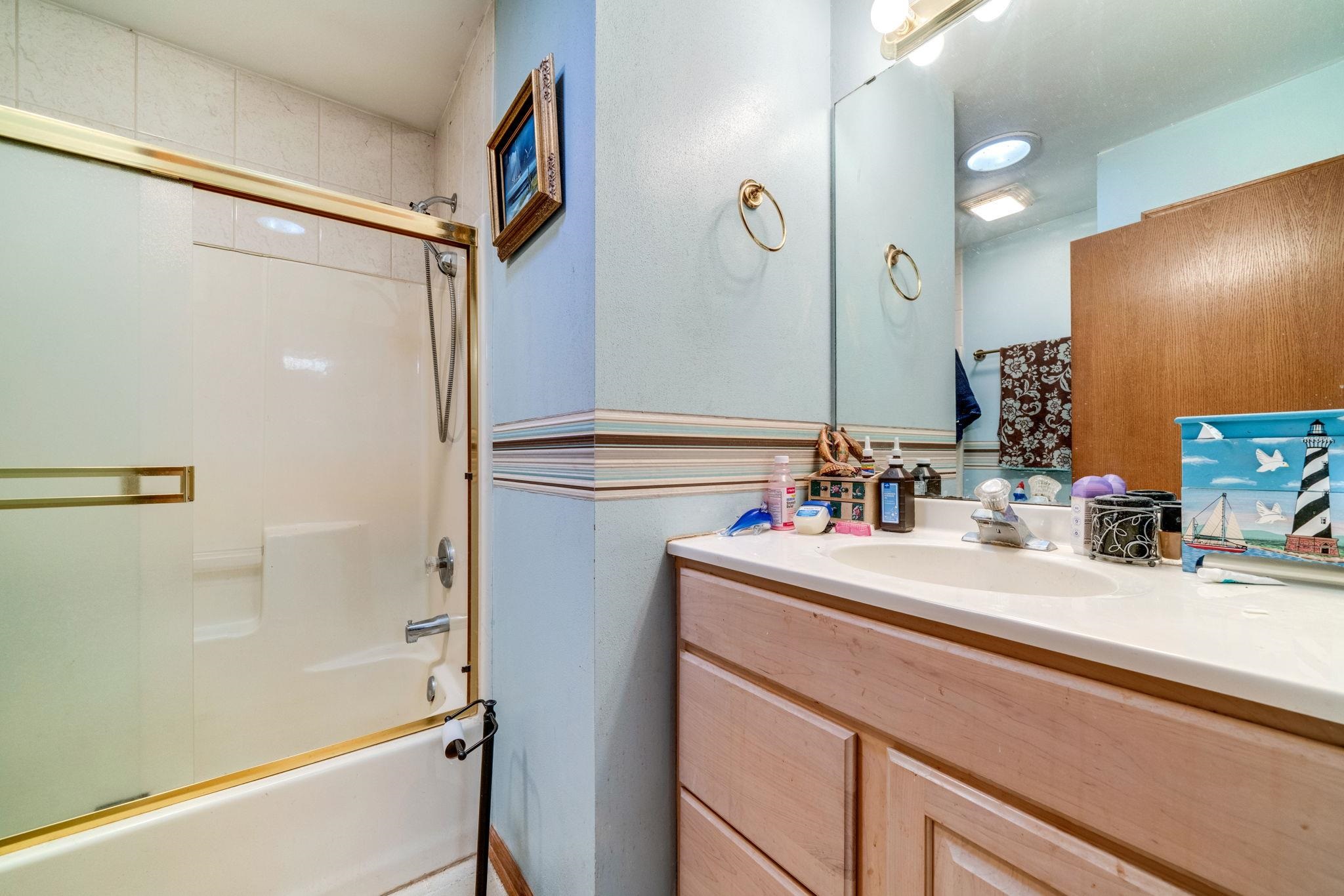 3734 Renfro Road Cherry Valley, IL 61016 - Photo 31 of 39 a bathroom with a sink and a mirror