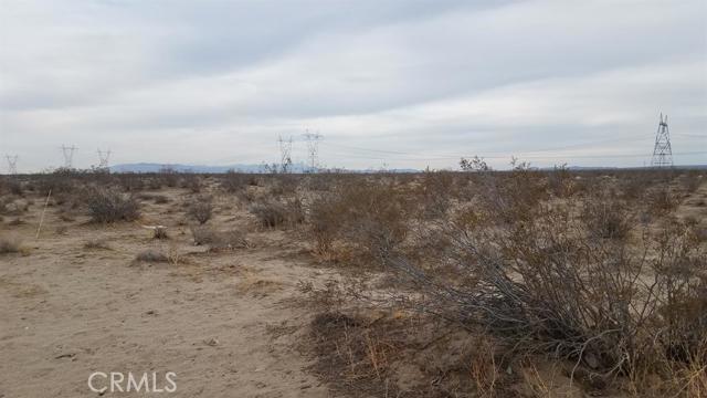 0 Sandstone Road Phelan, CA 92371 - Photo 3 of 4 a view of a dry field with trees in background