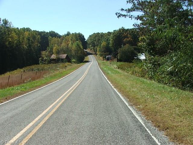 30 Flat Rock Road, Unit 30 Pinnacle, NC 27043 - Photo 16 of 22 ROAD FRONTAGE ON FLAT ROCK ROAD ON RIGHT AND BARN AND 3 ACRES+/- ON LEFT