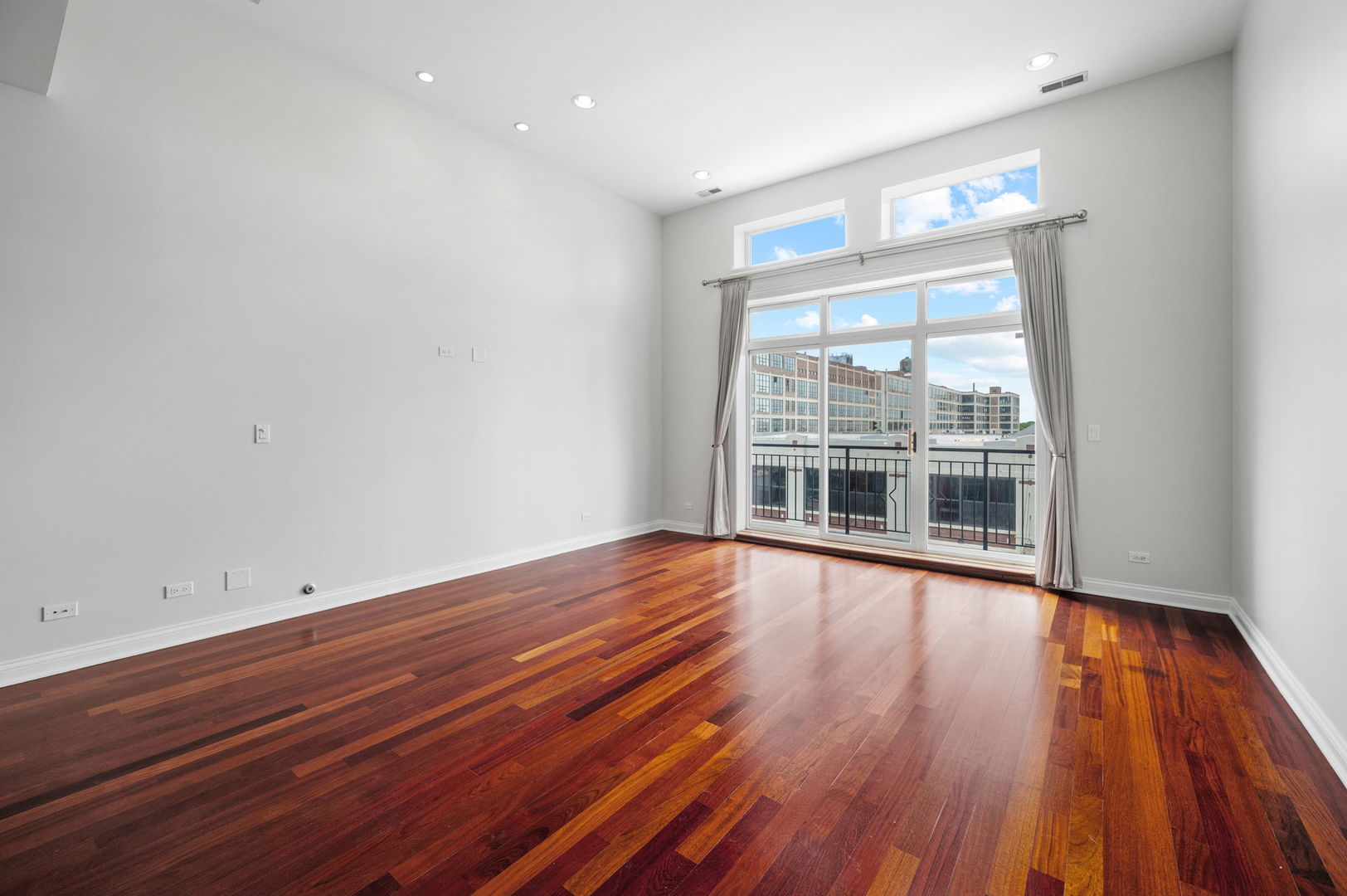 2847 North Pulaski Road, Unit 3S Chicago, IL 60641 - Photo 3 of 25 wooden floor in an empty room with a window