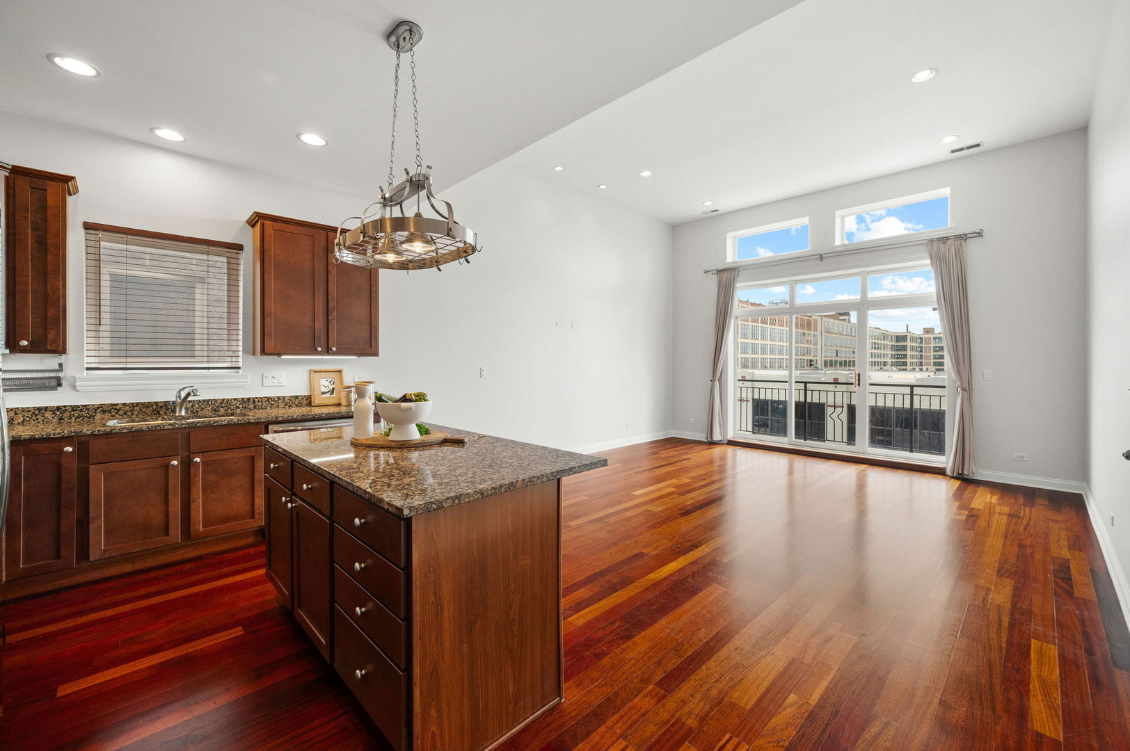 2847 North Pulaski Road, Unit 3S Chicago, IL 60641 - Photo 8 of 25 a kitchen with stainless steel appliances granite countertop wooden floors and granite counter tops