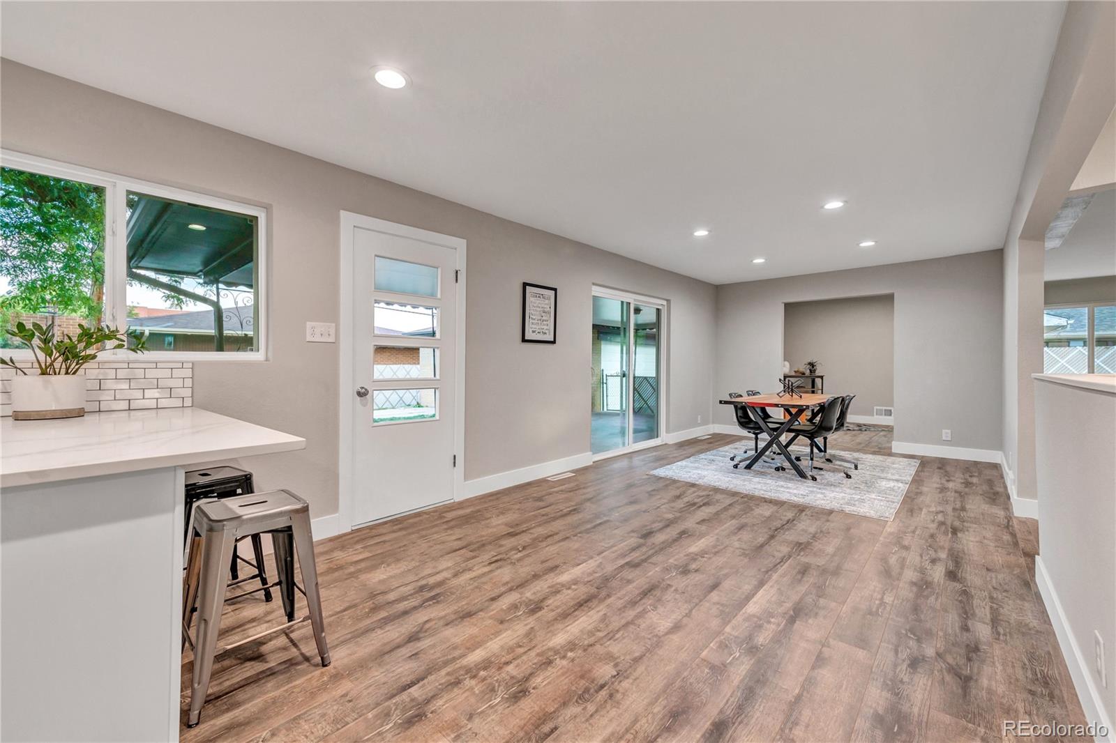 3880 Allison Street Wheat Ridge, CO 80033 - Photo 11 of 25 a view of a work space with furniture and wooden floor