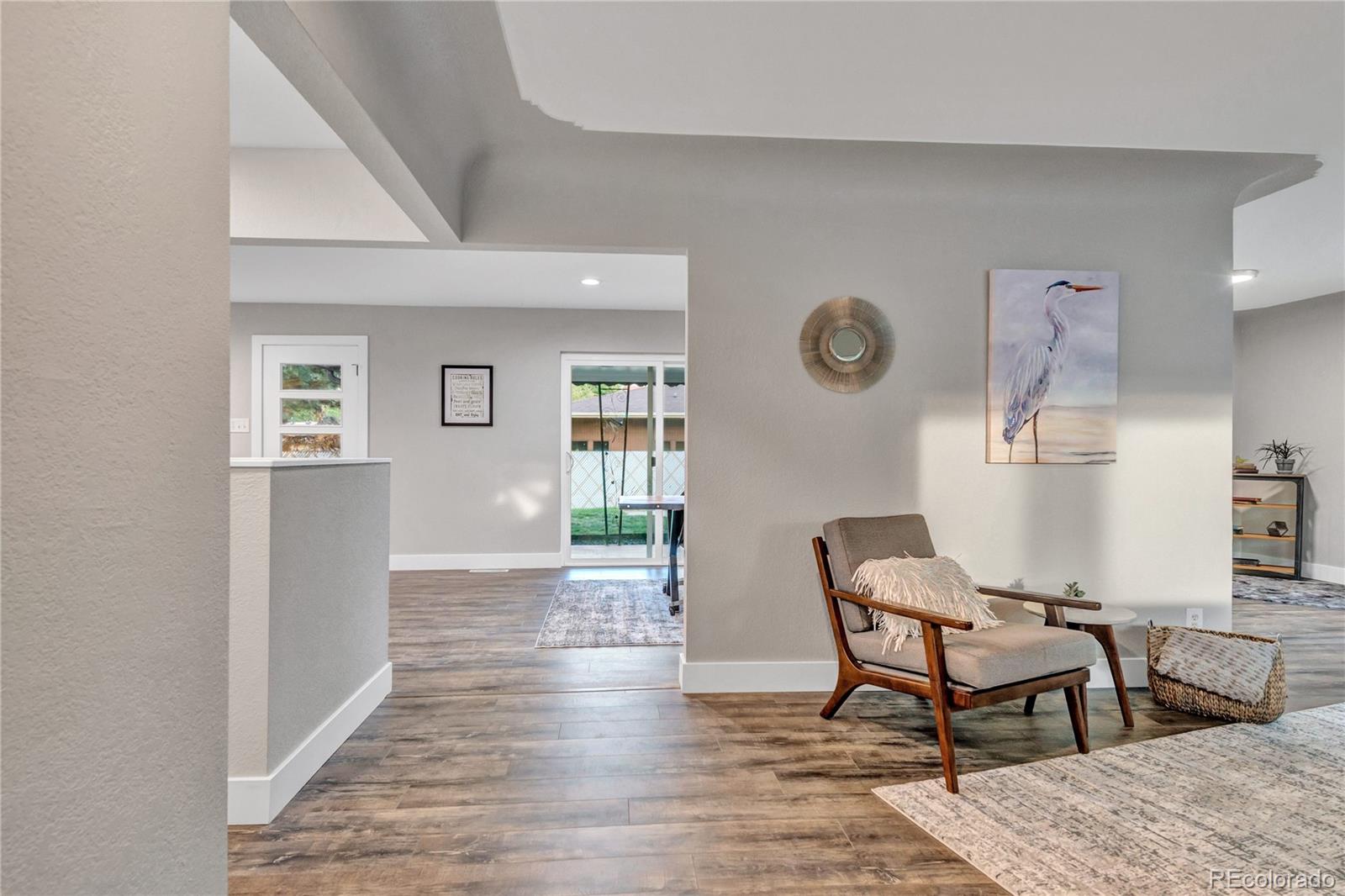 3880 Allison Street Wheat Ridge, CO 80033 - Photo 18 of 25 a view of a livingroom with furniture and wooden floor