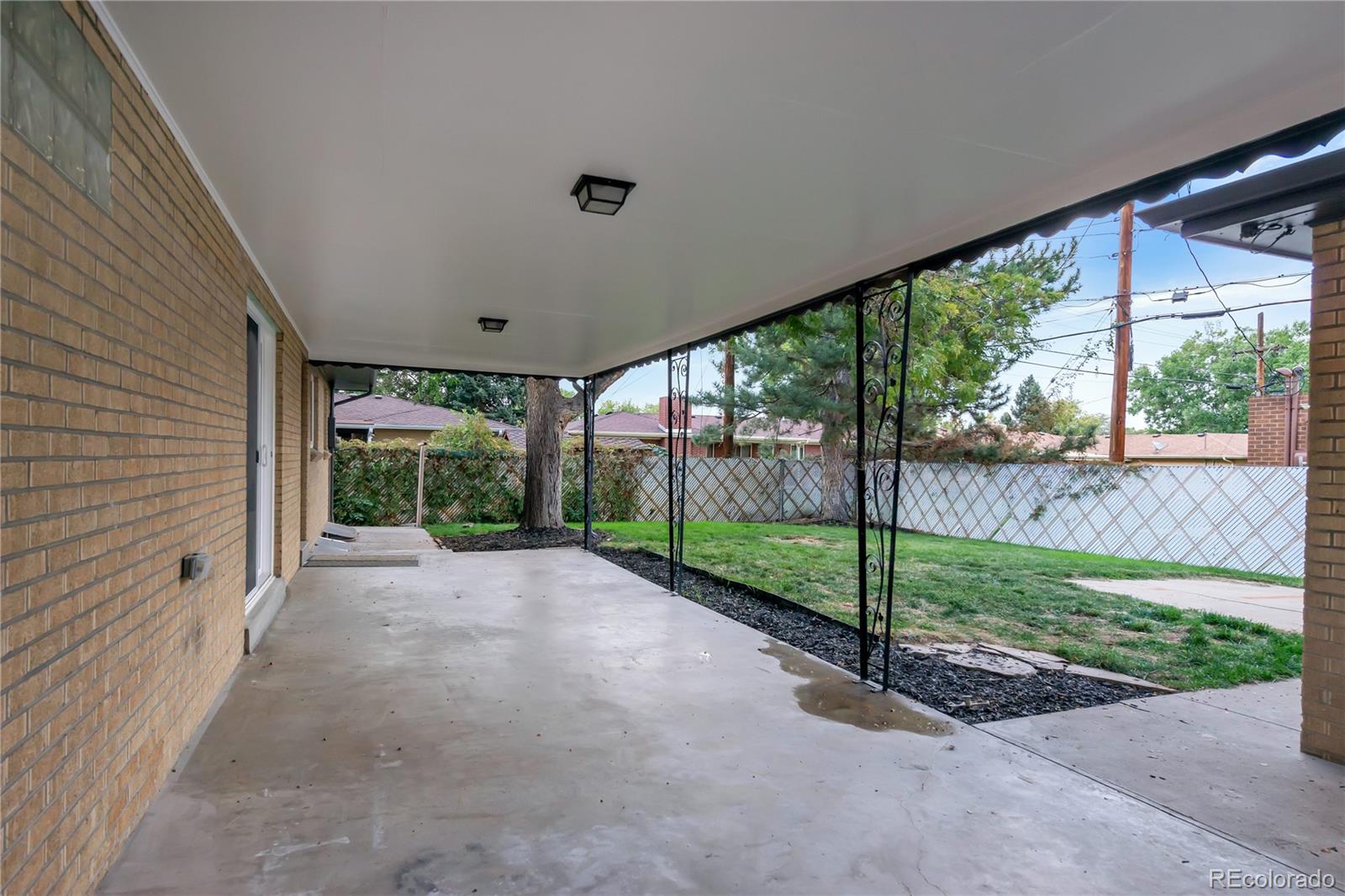 3880 Allison Street Wheat Ridge, CO 80033 - Photo 24 of 25 a view of a garden with porch