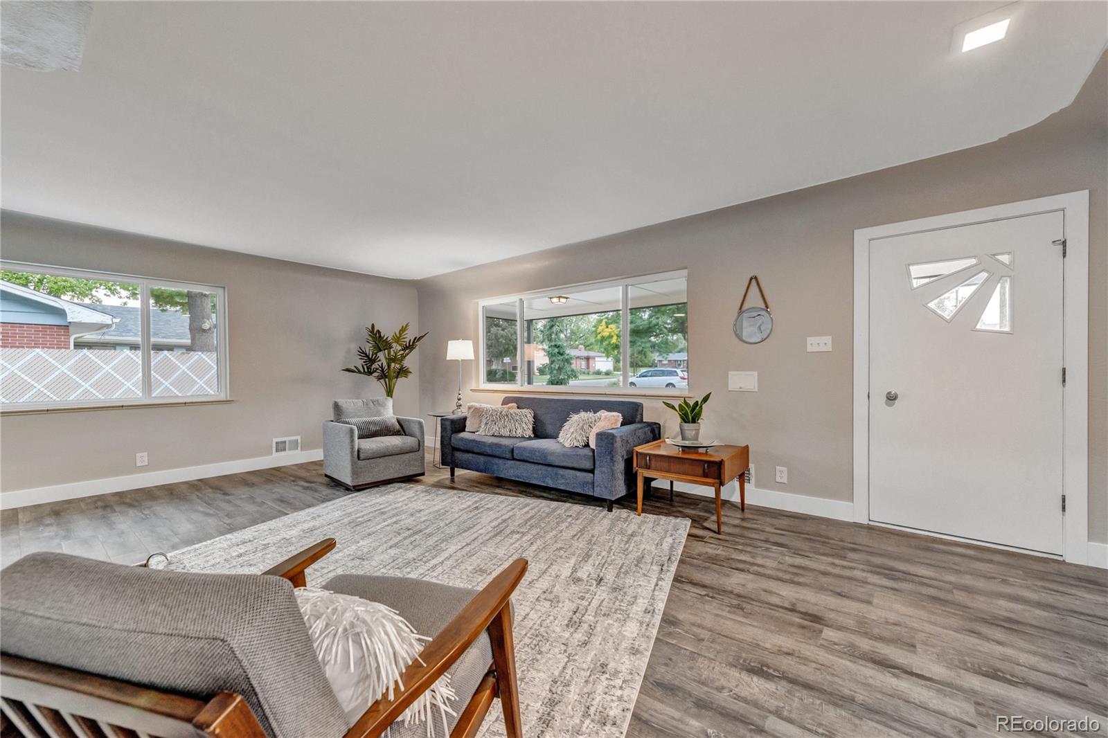 3880 Allison Street Wheat Ridge, CO 80033 - Photo 3 of 25 a living room with furniture and a large window