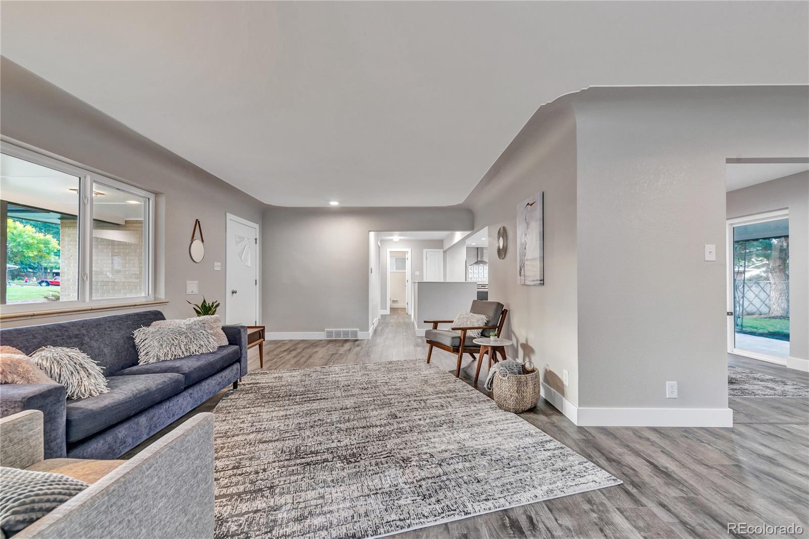 3880 Allison Street Wheat Ridge, CO 80033 - Photo 5 of 25 a living room with furniture and a table
