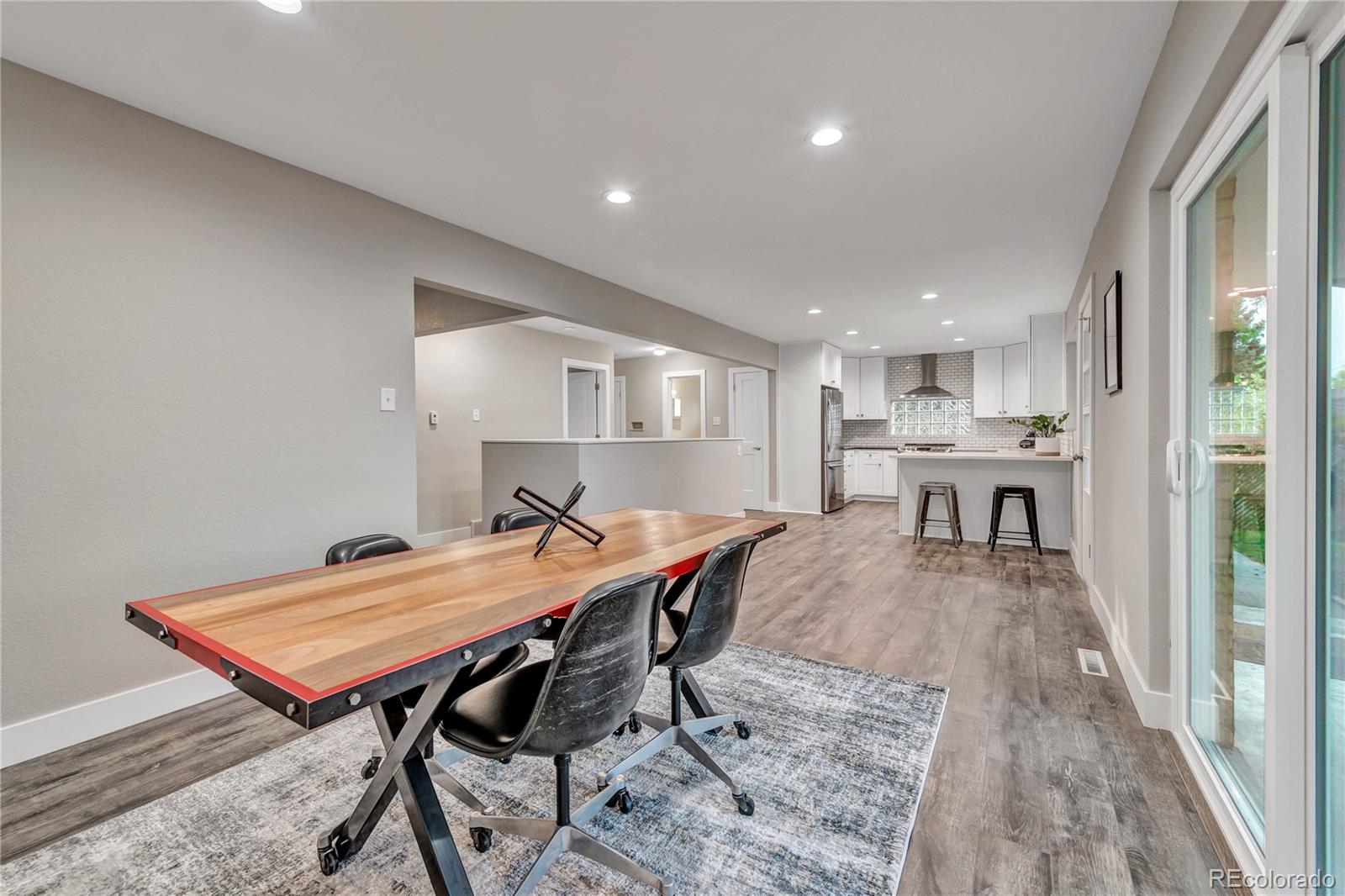 3880 Allison Street Wheat Ridge, CO 80033 - Photo 7 of 25 a view of a kitchen with a table and chairs