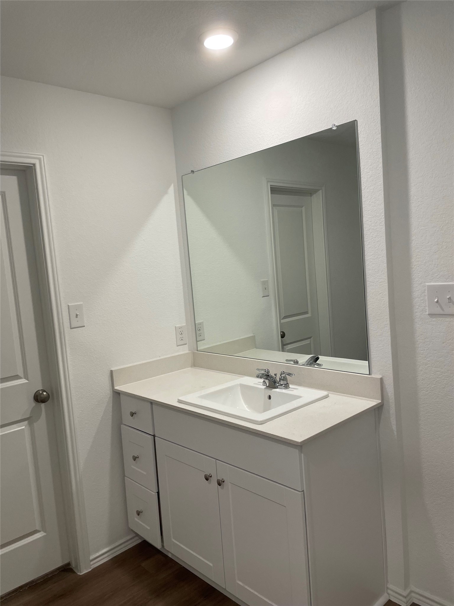 580 Rancho Del Cielo Loop Jarrell, TX 76537 - Photo 11 of 27 a bathroom with a sink a vanity and a mirror