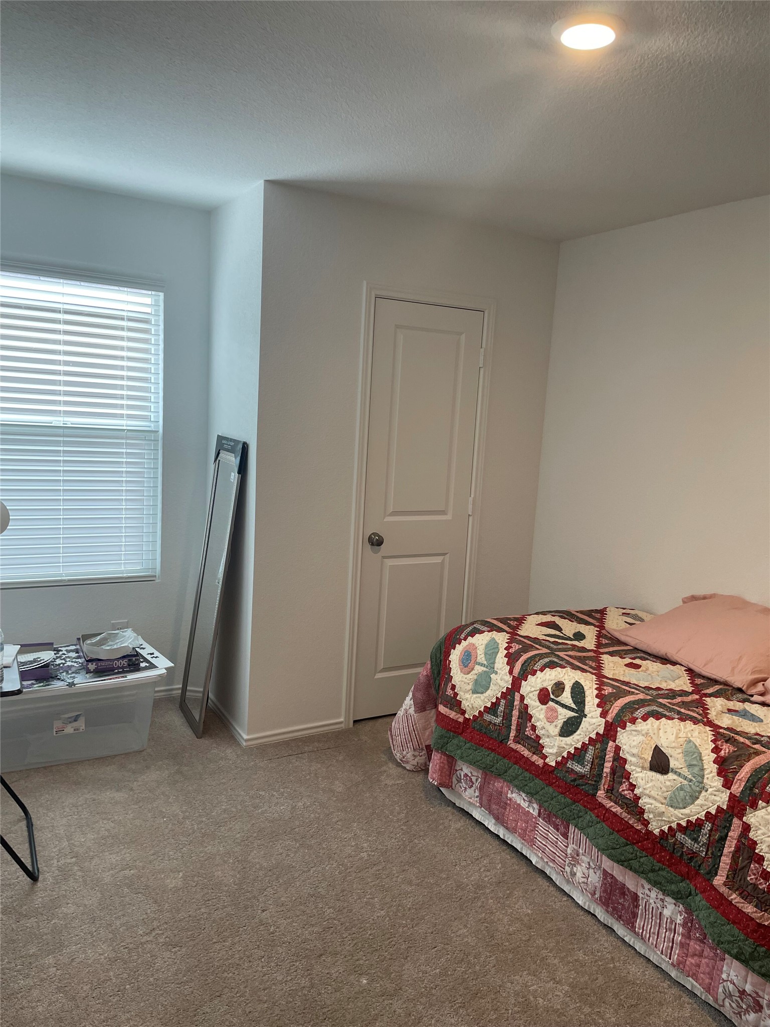 580 Rancho Del Cielo Loop Jarrell, TX 76537 - Photo 13 of 27 a bedroom with a bed and a window