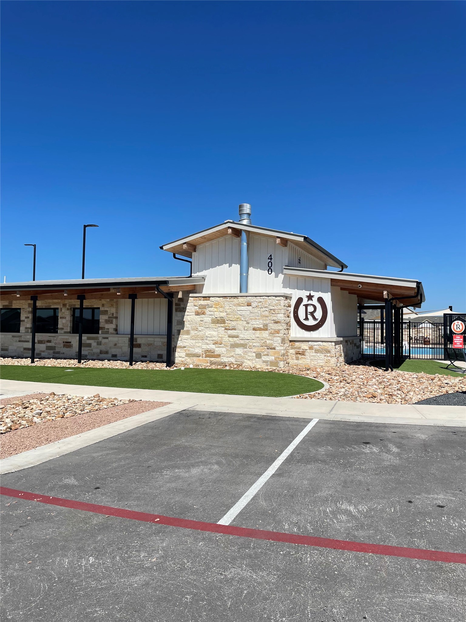 580 Rancho Del Cielo Loop Jarrell, TX 76537 - Photo 23 of 27 a view of a parking space in front of a building