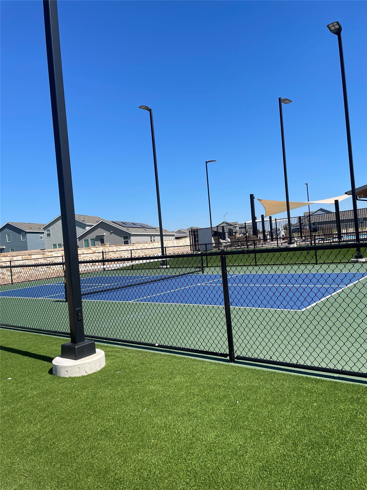 580 Rancho Del Cielo Loop Jarrell, TX 76537 - Photo 24 of 27 a view of a swimming pool with a yard