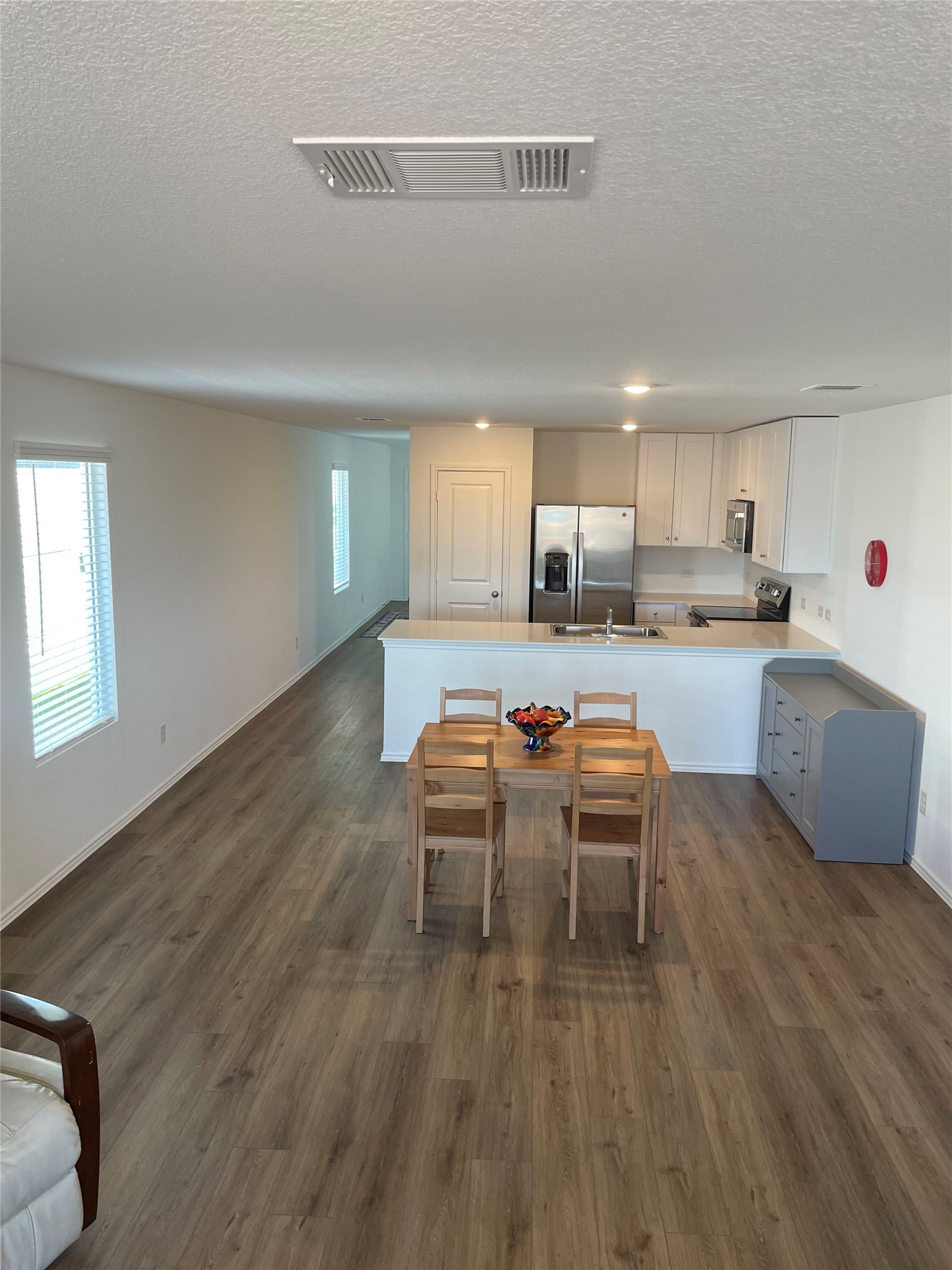 580 Rancho Del Cielo Loop Jarrell, TX 76537 - Photo 27 of 27 a kitchen with a table and chairs in it