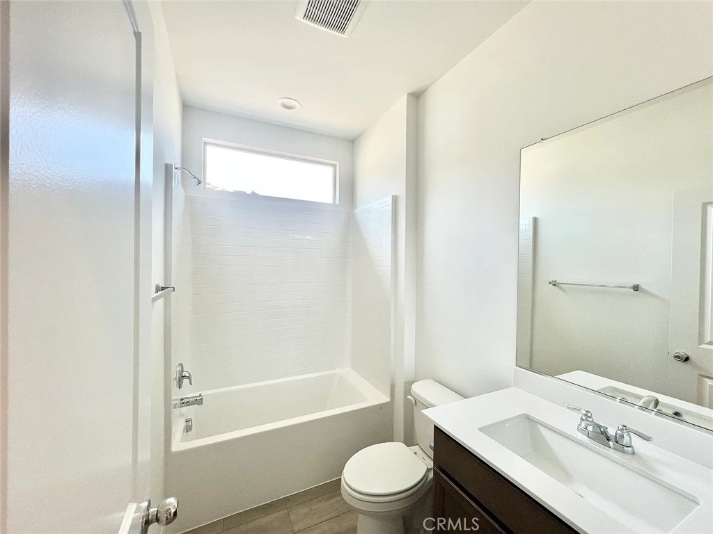 8285 Tristan Lane Riverside, CA 92507 - Photo 17 of 38 a bathroom with a sink a toilet and shower