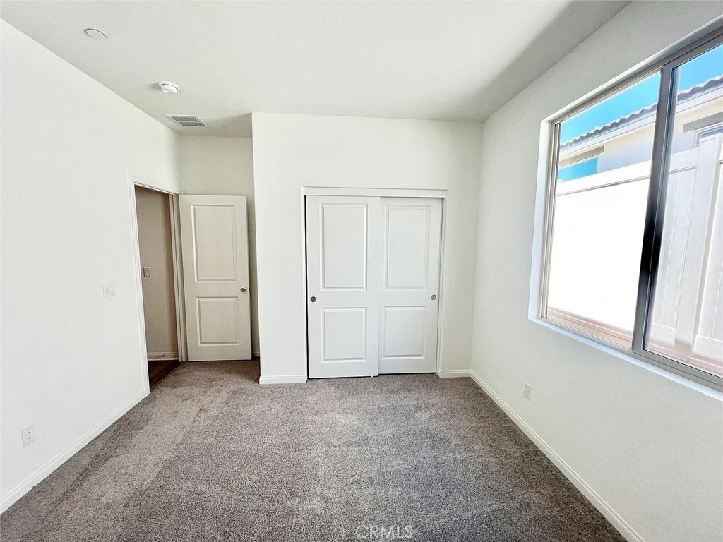 8285 Tristan Lane Riverside, CA 92507 - Photo 30 of 38 a view of an empty room with a window