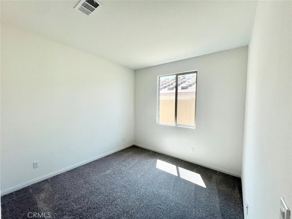 8285 Tristan Lane Riverside, CA 92507 - Photo 31 of 38 an empty room with a window