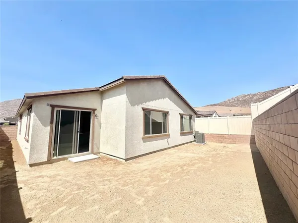 a view of house with yard