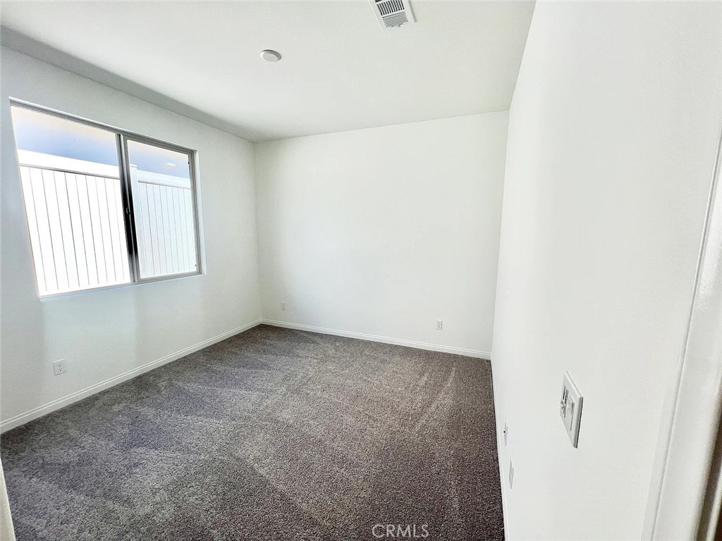 8285 Tristan Lane Riverside, CA 92507 - Photo 10 of 38 a view of an empty room with a window