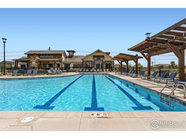 a view of swimming pool with seating area