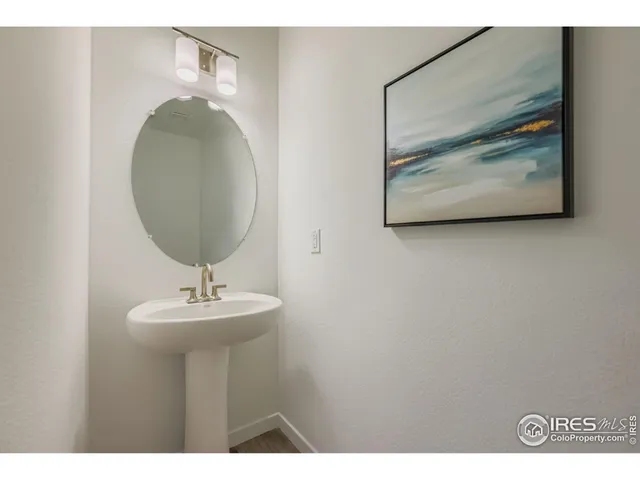 a bathroom with a sink and mirror