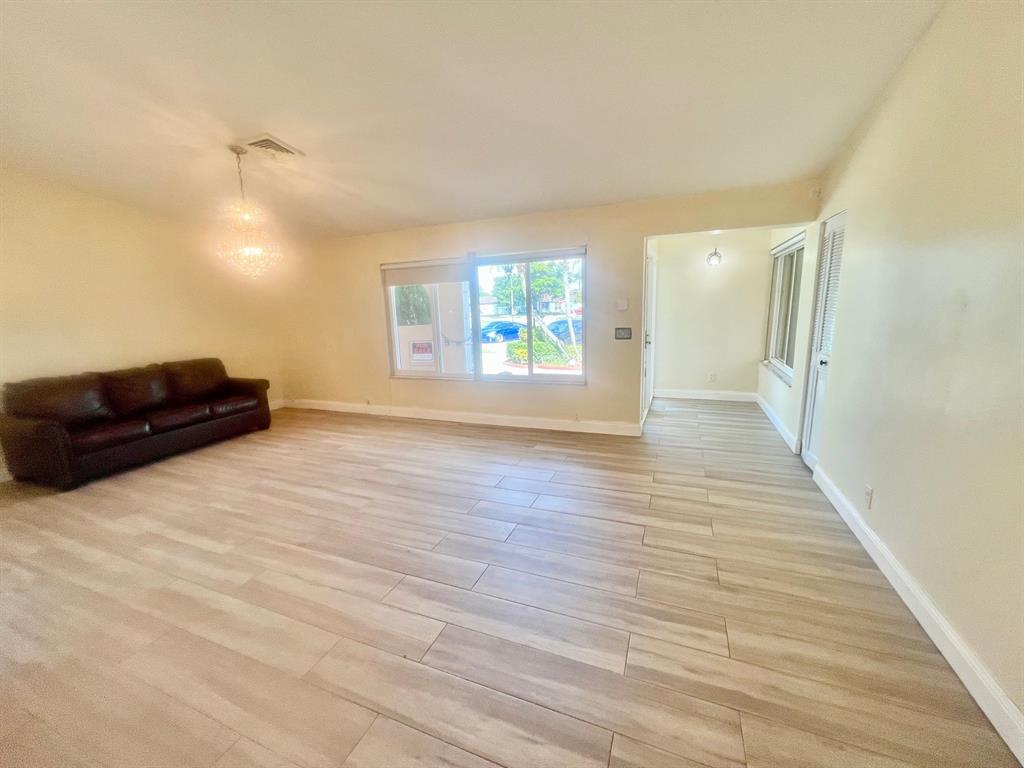 861 Southwest 55th Way Margate, FL 33068 - Photo 20 of 45 a view of a room with wooden floor and window